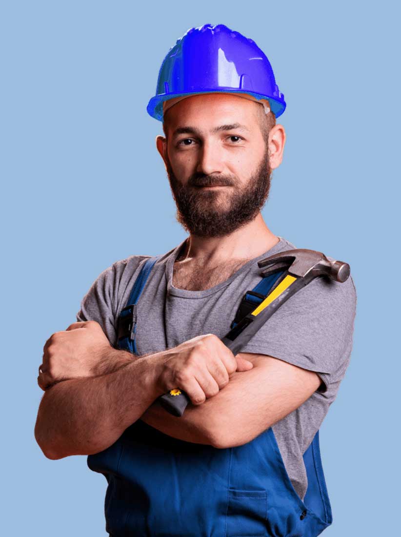 man in construction wear holding a hammer